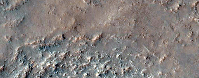 Mounds and Small Ridges along Wrinkle Ridge on Huygens Crater Floor 
