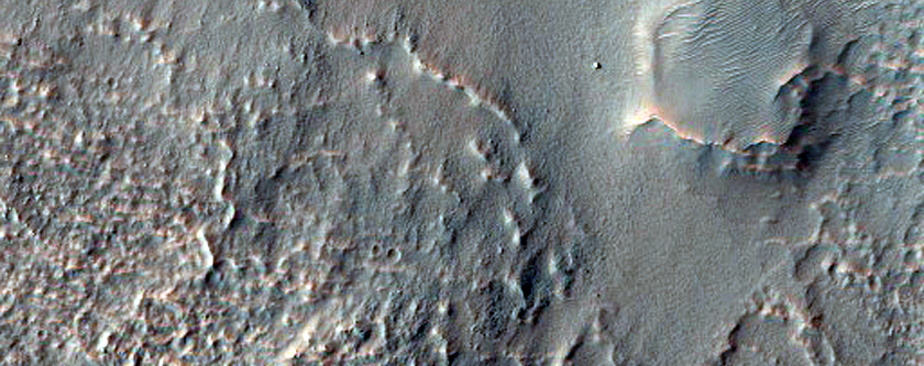 Material Flowing from a Breach in Moanda Crater in Nereidum Montes
