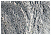 Massifs with Aprons and Lineated Valley Floor Material