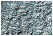 Channel Cutting Crater Wall in Nereidum Montes