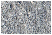 Channel That Appears to Emanate from Impact Ejecta