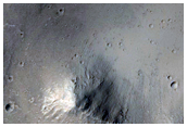 Crater with Large Mass Movement Features Off South Wall