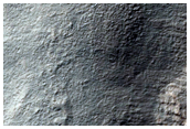 Layered Structures in Promethei Terra