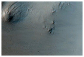 Valley Breaching Rim of Madler Crater