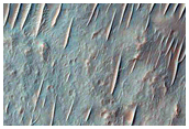 Light-Toned Material along Coprates Chasma Ridge