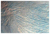 Light-Toned Layering along Floor of Small Trough Near Juventae Chasma