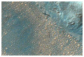 Slope Deposits Near Double Impact Crater