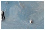 Dark Materials on West Flank of Olympus Mons