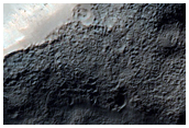 Shallow Crater with Pits in Terra Sirenum