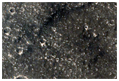 Crater Ejecta Blanket in Contact with Various Mesas and Buttes