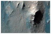Light-Toned Material along Coprates Chasma Wallrock