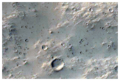 Interactions between Crater Ejecta Mantling Deposits and Flows