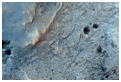 Vertically Tilted Blocks of Layers in Becquerel Crater