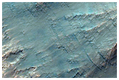 Light-Toned Material along Coprates Chasma Wallrock