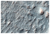 Possible Olivine and High-Calcium Pyroxene-Rich Region of Mariner Crater