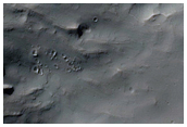 Slope with Boulder Tracks Formed between MOC Images R11-02300 and S01-00136
