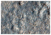 Fluvial Feature Apparently Emanating from Rampart Crater Ejecta
