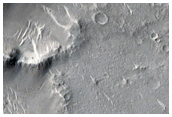 Ejecta and Rays Associated with Crater in Isidis Planitia