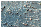 Possible Olivine Signature on Plains near Crater with Fluidized Ejecta