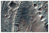 Layered Deposits in Central Pit of Large Crater