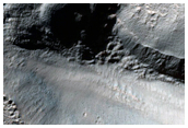 Crater Deposit with Layers Near Hellas Basin