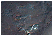 Light-Toned Material along Coprates Chasma Wallrock and Plateau
