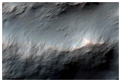 Impact Crater Exposing Bedrock