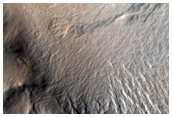Dark Slope Streak Extending to Channel Floor