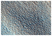 Layered Ejecta Flow Over Preexisting Crater