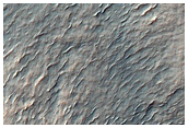 Crater Ejecta and Wrinkle Ridge