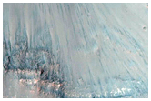Light-Toned Layering along Floor of Small Trough Near Juventae Chasma
