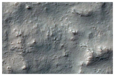 Recent Crater on Rocky Crater Floor