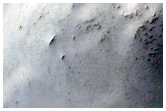 Wrinkle Ridge and Crater Intersection in Terra Sabaea