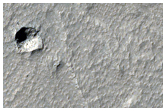 Possible Pits in Lava Flows in Daedalia Planum