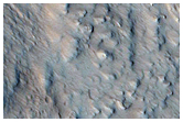 Western Portion of Well-Preserved 15-Kilometer Crater Near Alba Mons
