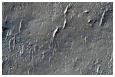 Contact between Layered Impact Ejecta and Eroded Bedrock