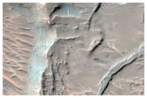 Layered Bedrock on Floor of Millochau Crater