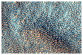 Possible Olivine in Ejecta of Northern Plains Crater
