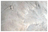 Impact Crater in the Tartarus Montes