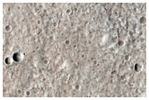 Crater Cluster Superimposed on Larger Crater on Alba Patera