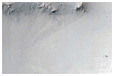 Small Valleys around Impact Crater in Syrtis Major Region