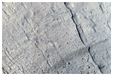 Layers on Pedestal Crater in Tikhonravov Crater