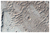 Stratified Material in Depression in Gigas Fossae