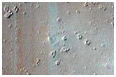 Recent Chain of Dark Spot Craters Southwest of Ascraeus Mons