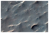 Possible Phyllosilicates on Floor of Huygens Crater