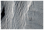 Crater Deposit Erosion in Lucus Planum
