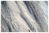 Eroded Scarp Near Terminus of Valleys on Western Hecates Tholus
