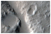 Channels and Fans along Hecates Tholus