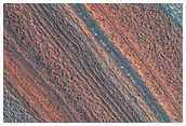 Layered Deposits Draped over Existing Topography
