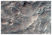 Crater with Fans and Layered Bedrock